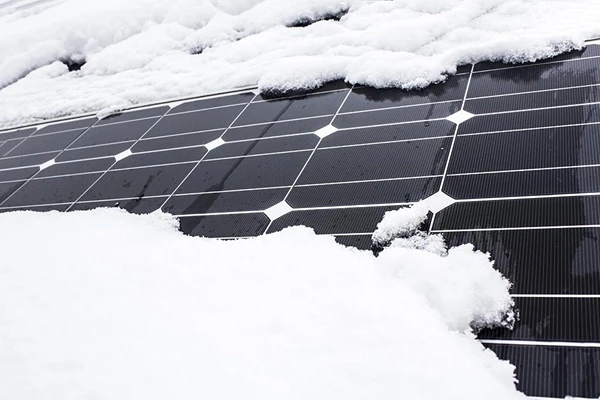 solar panel covered with heavy snow
